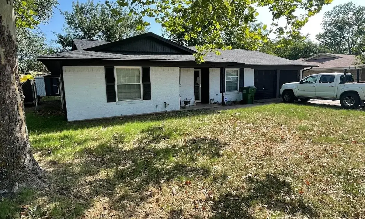 Professional roofing crew working on a residential roof in Eden Isle